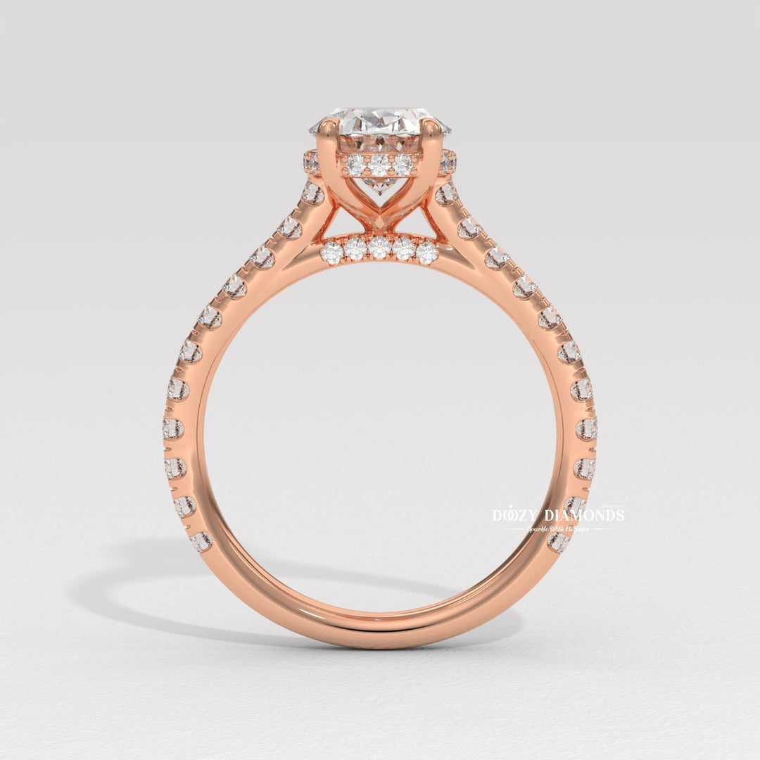 Oval halo engagement ring viewed from the side
