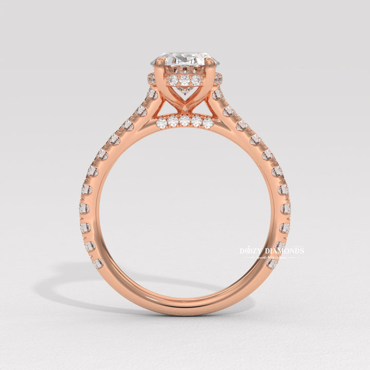 Oval halo engagement ring viewed from the side