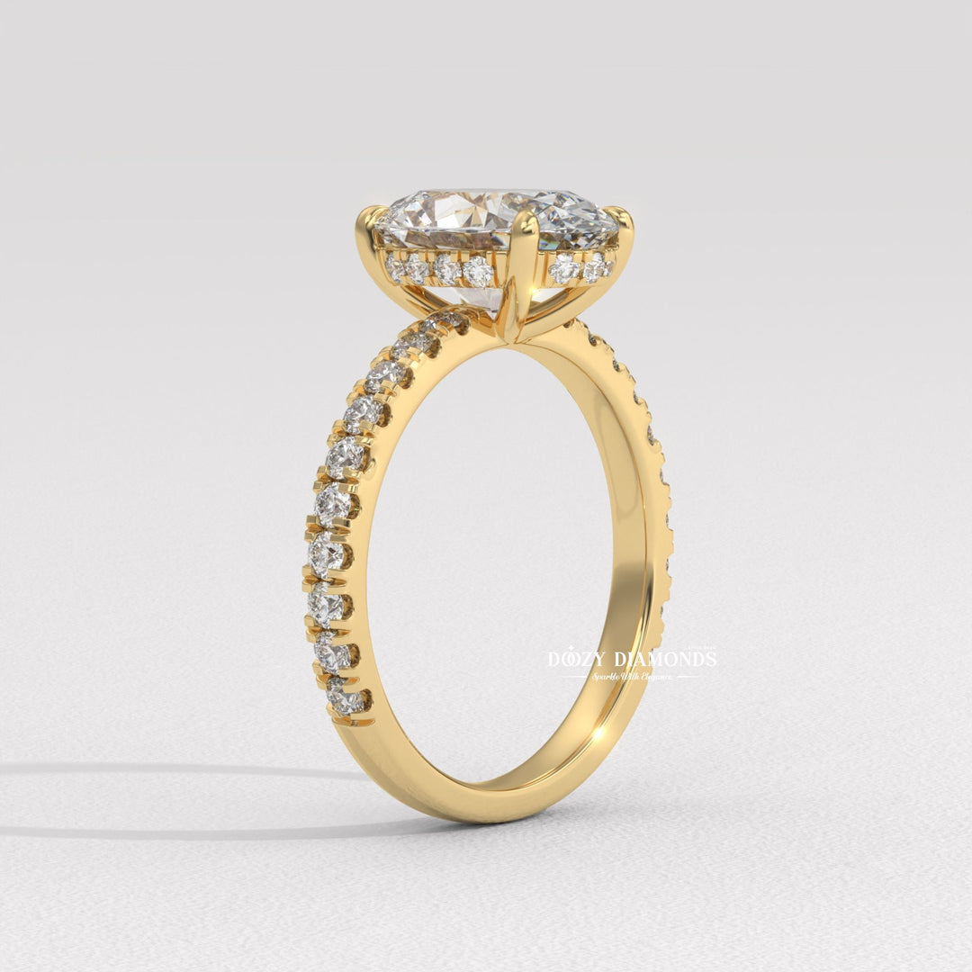 Macro shot of oval cut diamond facets in hidden halo ring setting