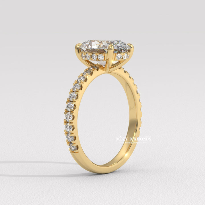 Macro shot of oval cut diamond facets in hidden halo ring setting