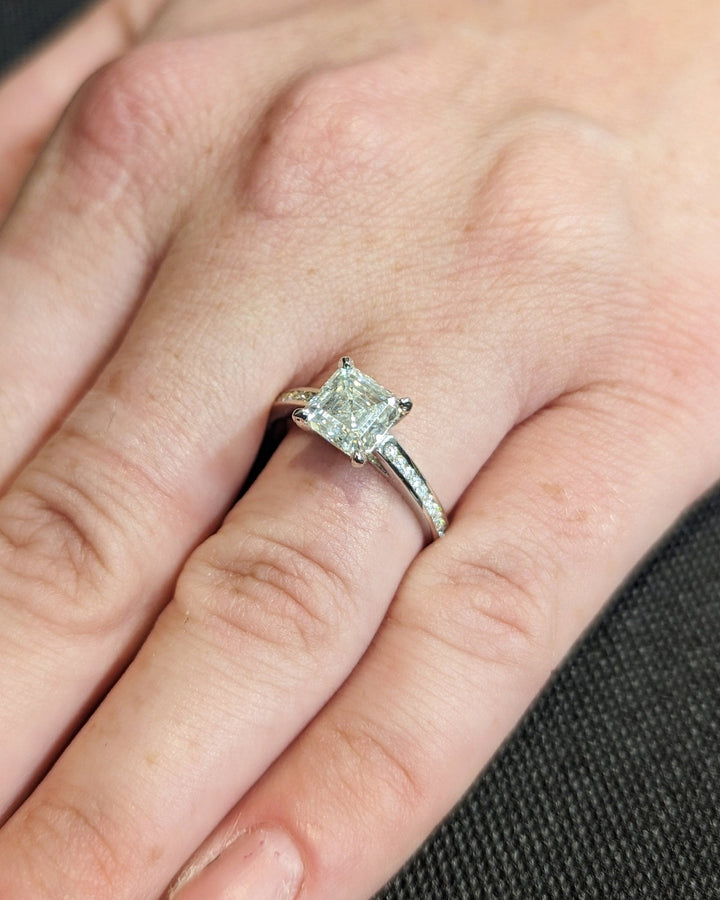 Asscher solitaire engagement ring shown on hand for true-to-life sizing