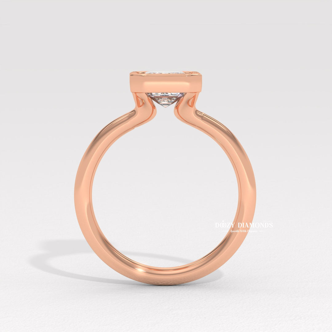 Emerald bezel lab grown diamond ring fitted on finger