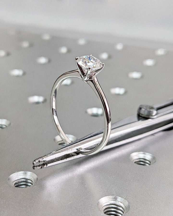 Round solitaire lab grown diamond ring side profile in gold setting