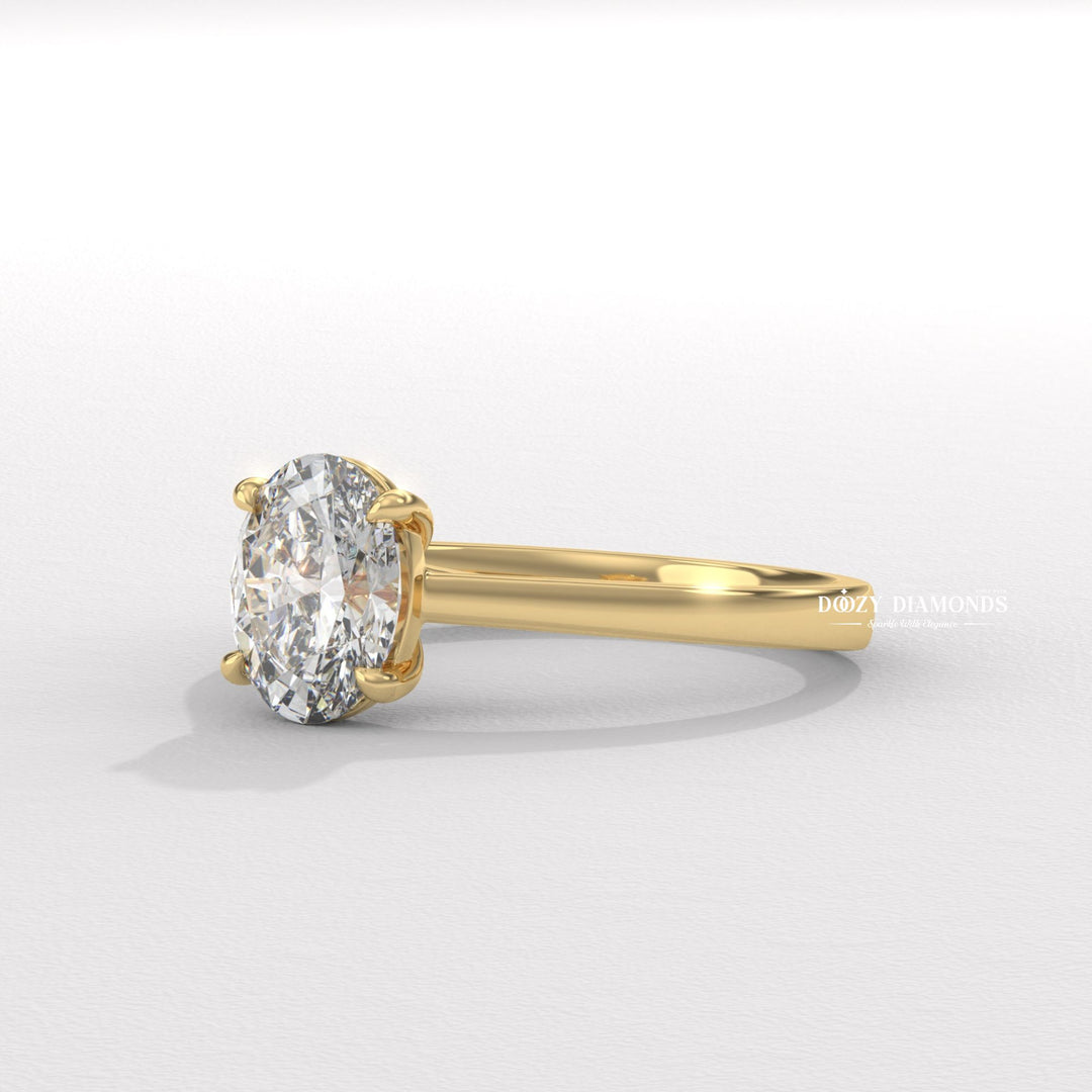 Oval solitaire engagement ring finished in polished solid gold