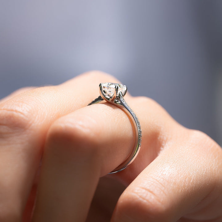 Cushion hidden halo diamond ring presented in signature gift packaging