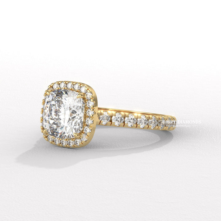 Angled view of cushion cut diamond in halo setting