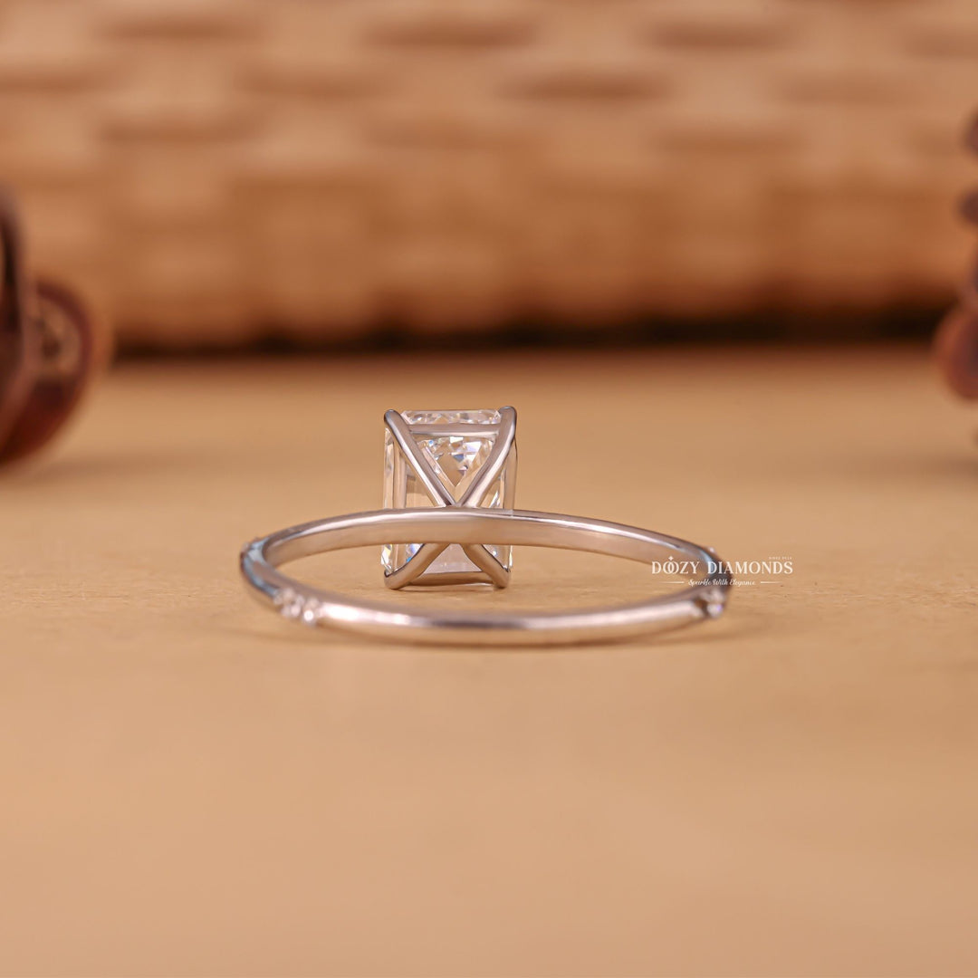 Emerald cut diamond ring worn on hand