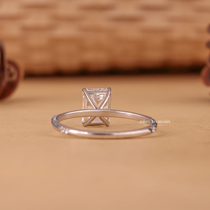 Emerald cut diamond ring worn on hand