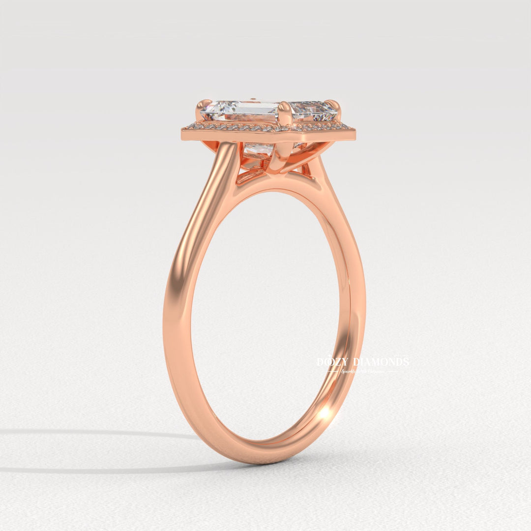 Emerald halo diamond ring presented in signature gift packaging