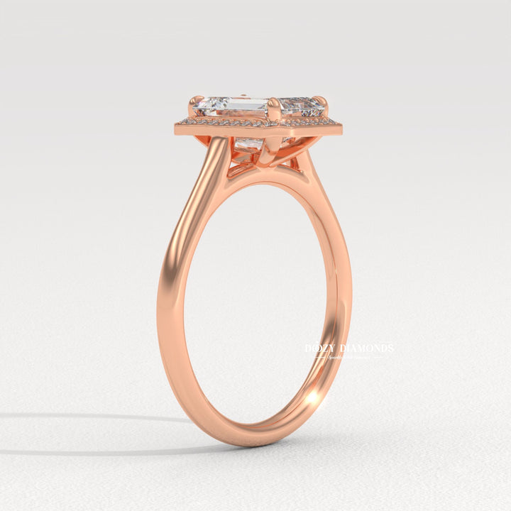 Emerald halo diamond ring presented in signature gift packaging