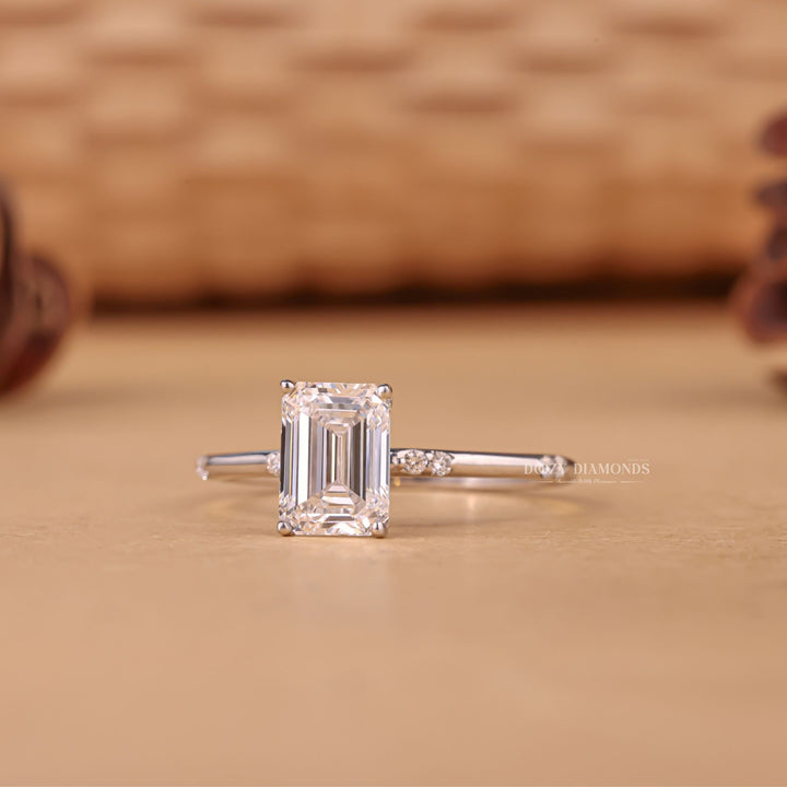 Emerald pave engagement ring shown on hand for true-to-life sizing