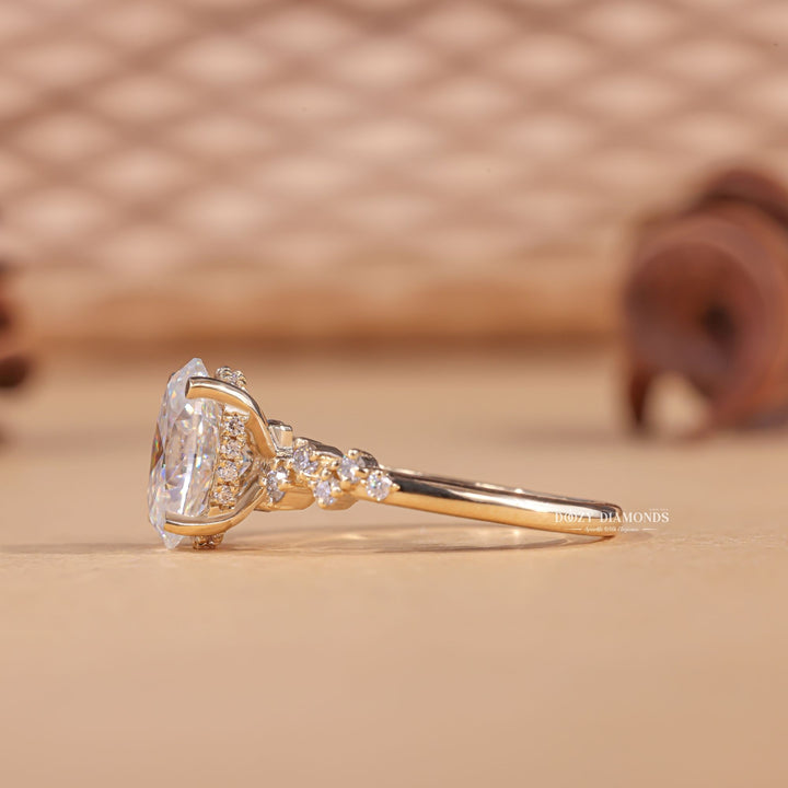 Macro shot of oval cut diamond facets in pave ring setting