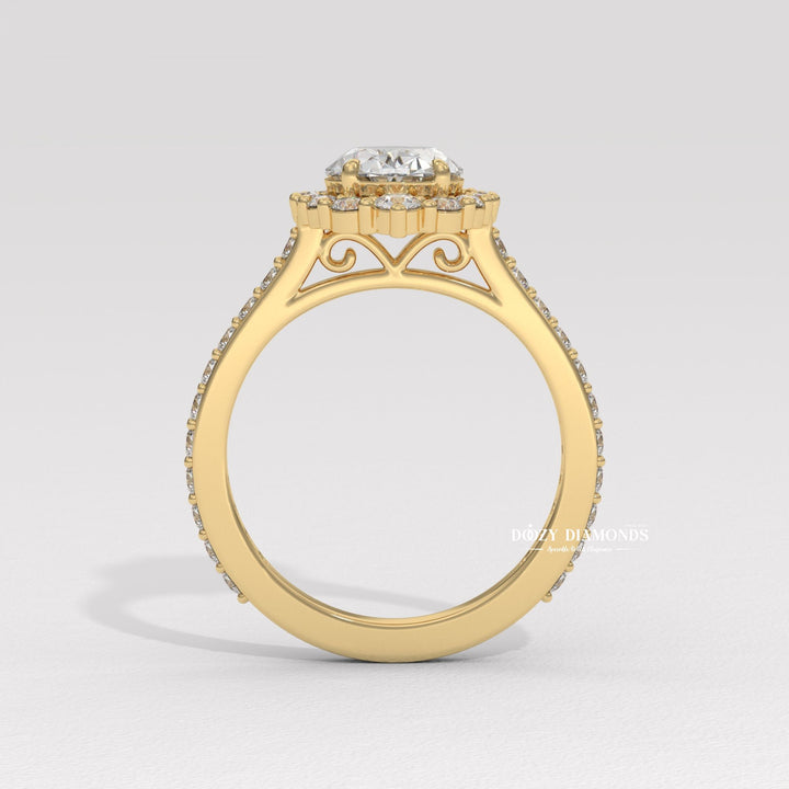 Oval halo engagement ring viewed from the side