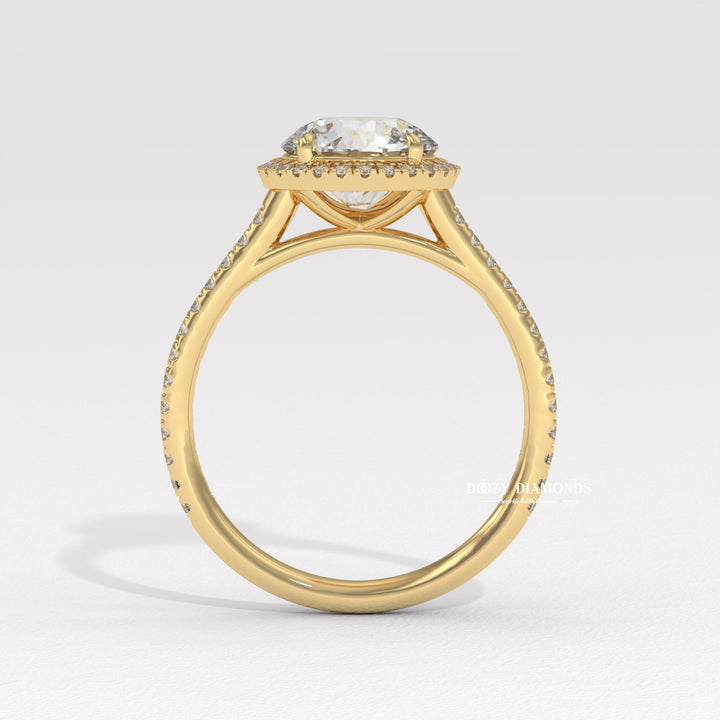 Round halo engagement ring photographed in natural light
