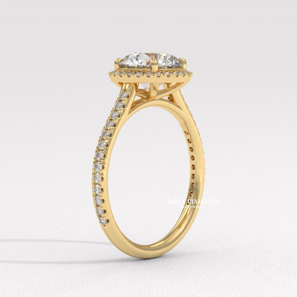 Round halo engagement ring finished in polished solid gold