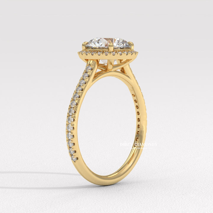 Round halo engagement ring finished in polished solid gold