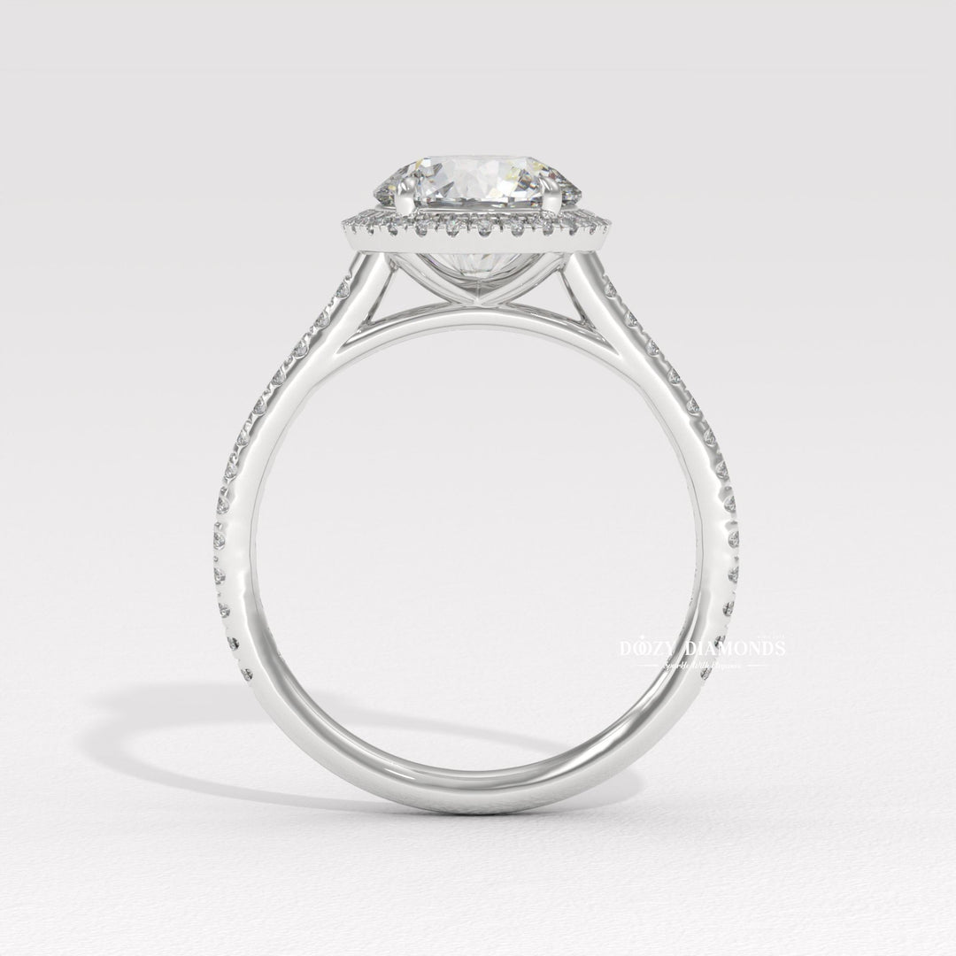 Macro shot of round cut diamond facets in halo ring setting