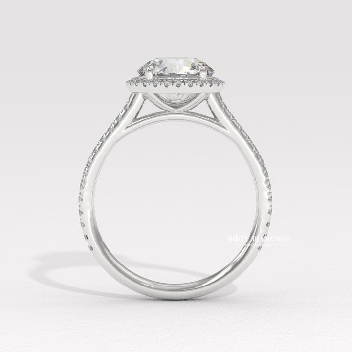Macro shot of round cut diamond facets in halo ring setting