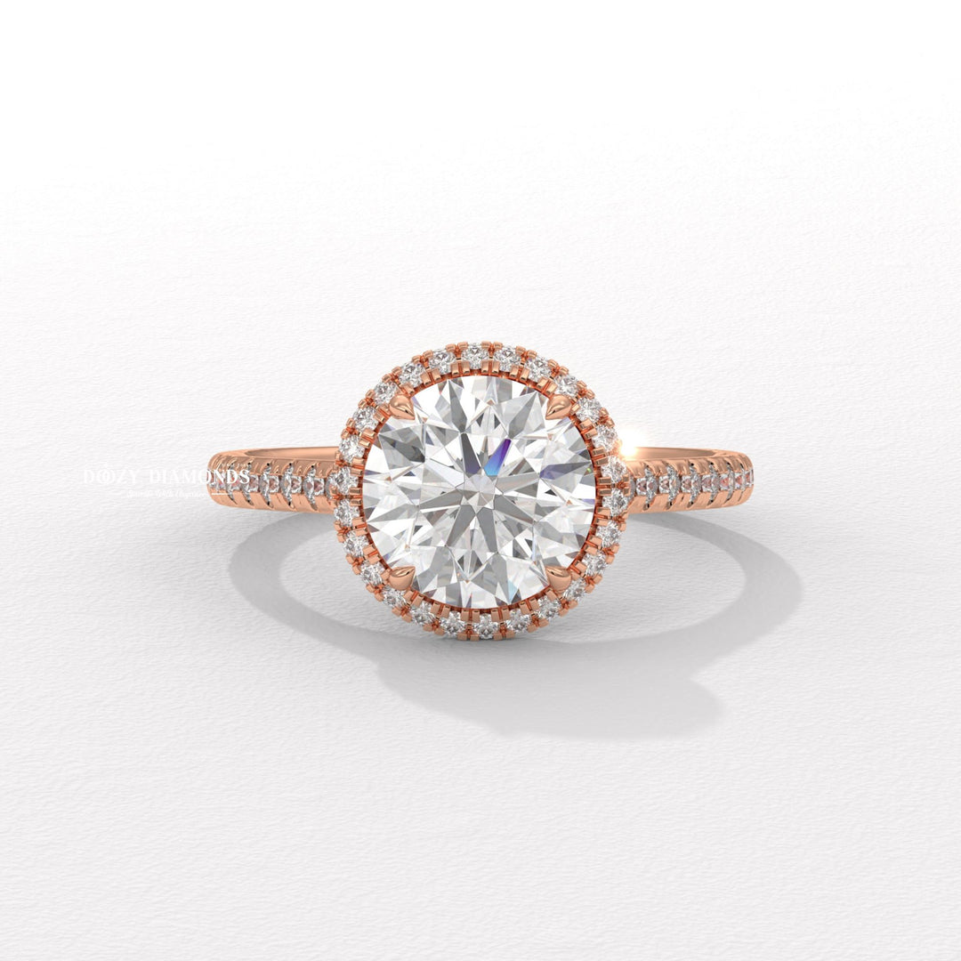 Round halo diamond ring displayed on jewelry stand