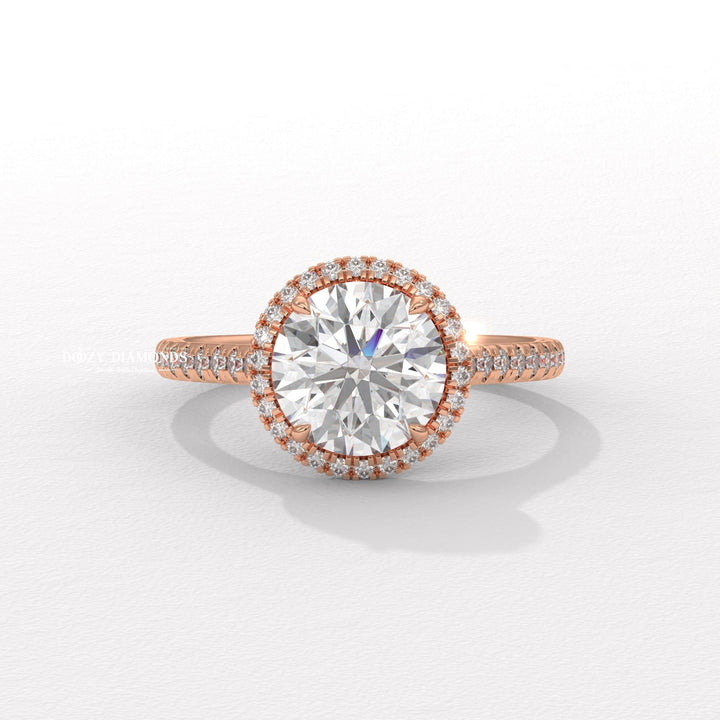 Round halo diamond ring displayed on jewelry stand