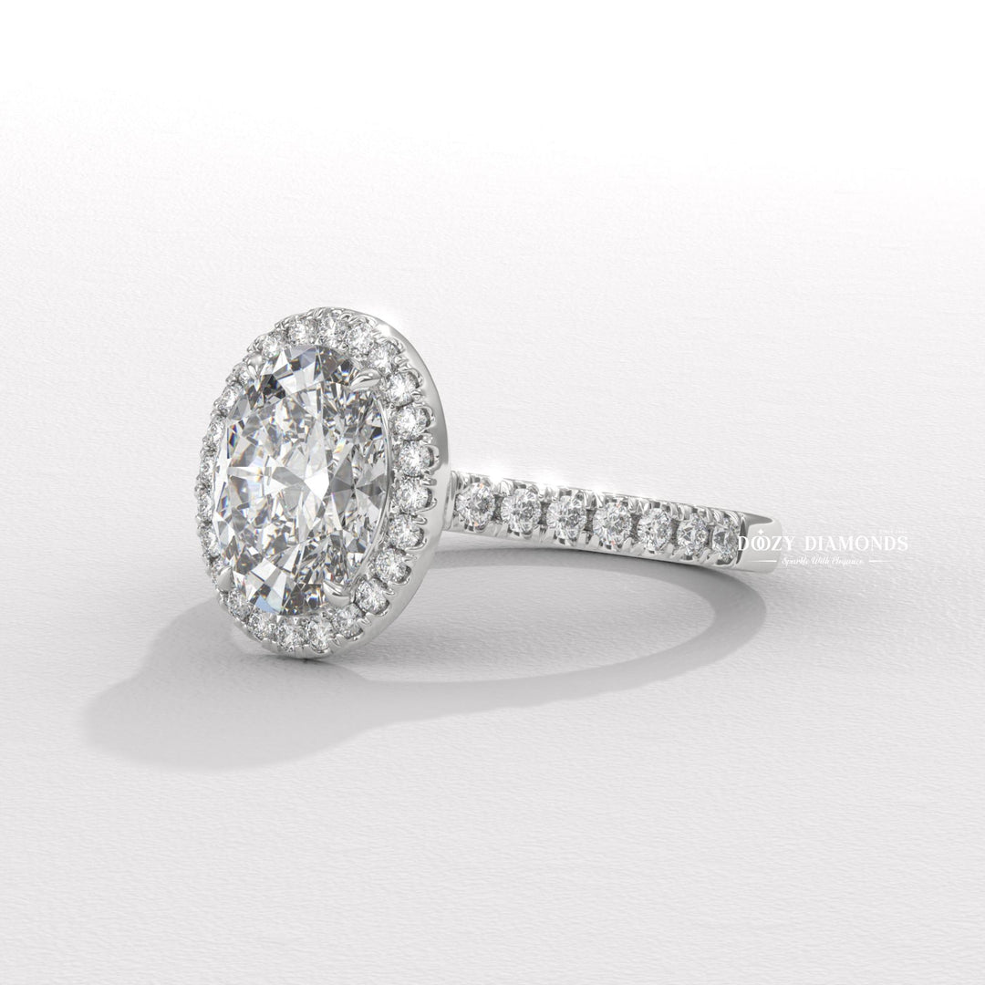 Certified oval cut diamond featured in halo engagement ring