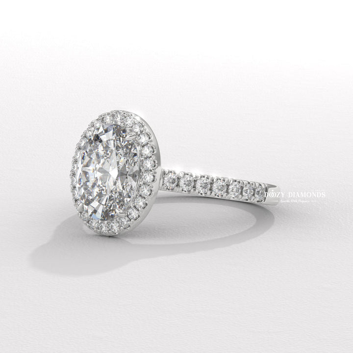 Certified oval cut diamond featured in halo engagement ring