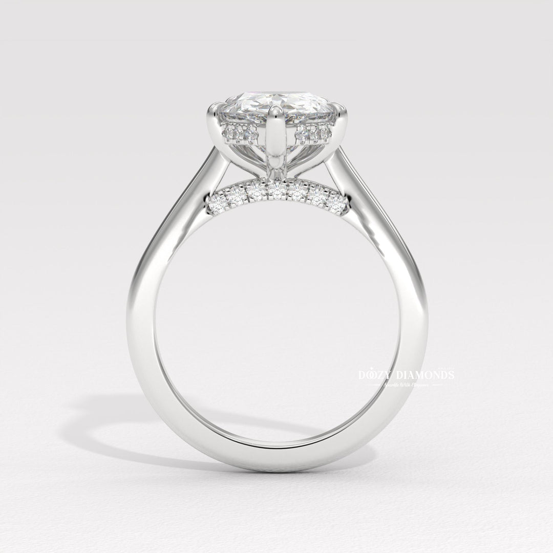 Fine craftsmanship detail on pear solitaire engagement ring