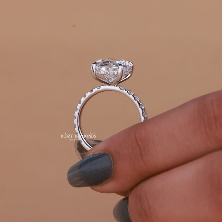 Oval hidden halo ring set with an IGI graded diamond