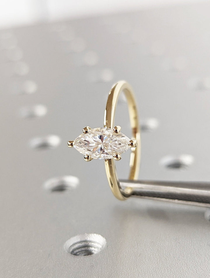IGI certified marquise cut diamond in solitaire engagement ring setting
