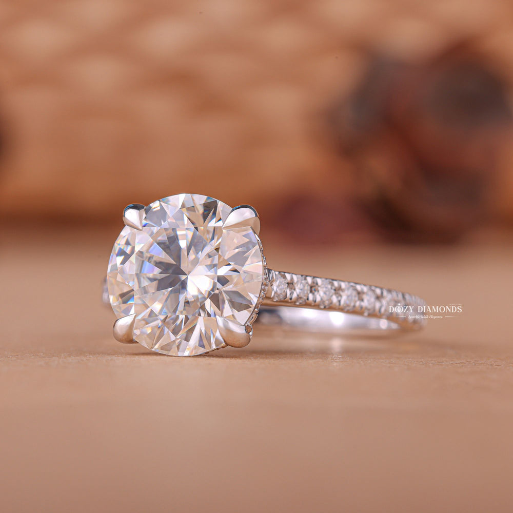 Profile view of round cut hidden halo engagement ring band