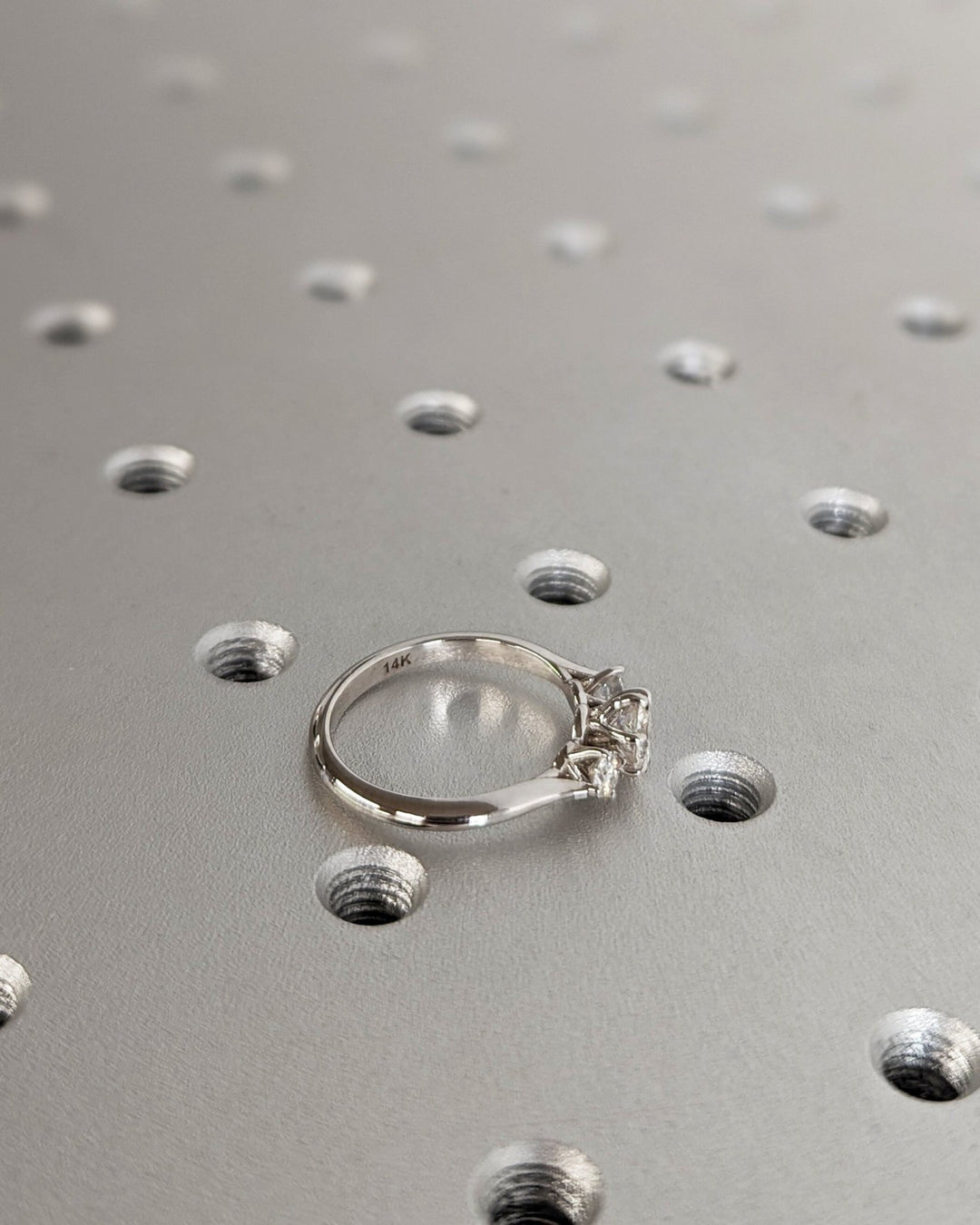Round three stone engagement ring with brilliant diamond sparkle