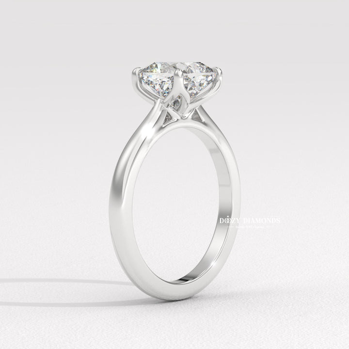 Cushion solitaire engagement ring photographed in natural light