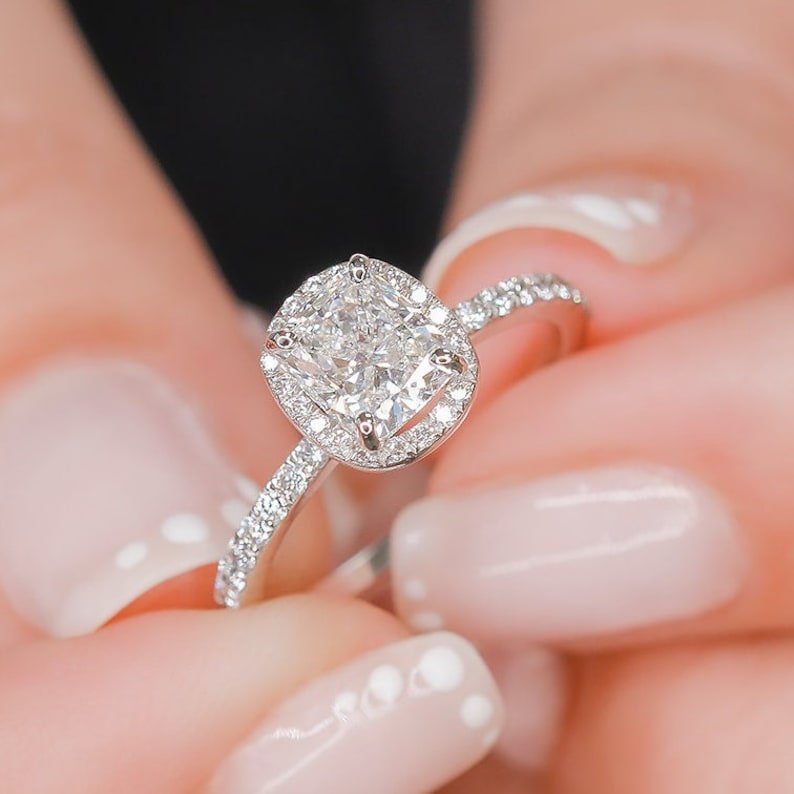 Profile view of cushion cut halo engagement ring band
