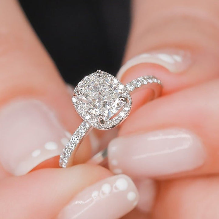Profile view of cushion cut halo engagement ring band
