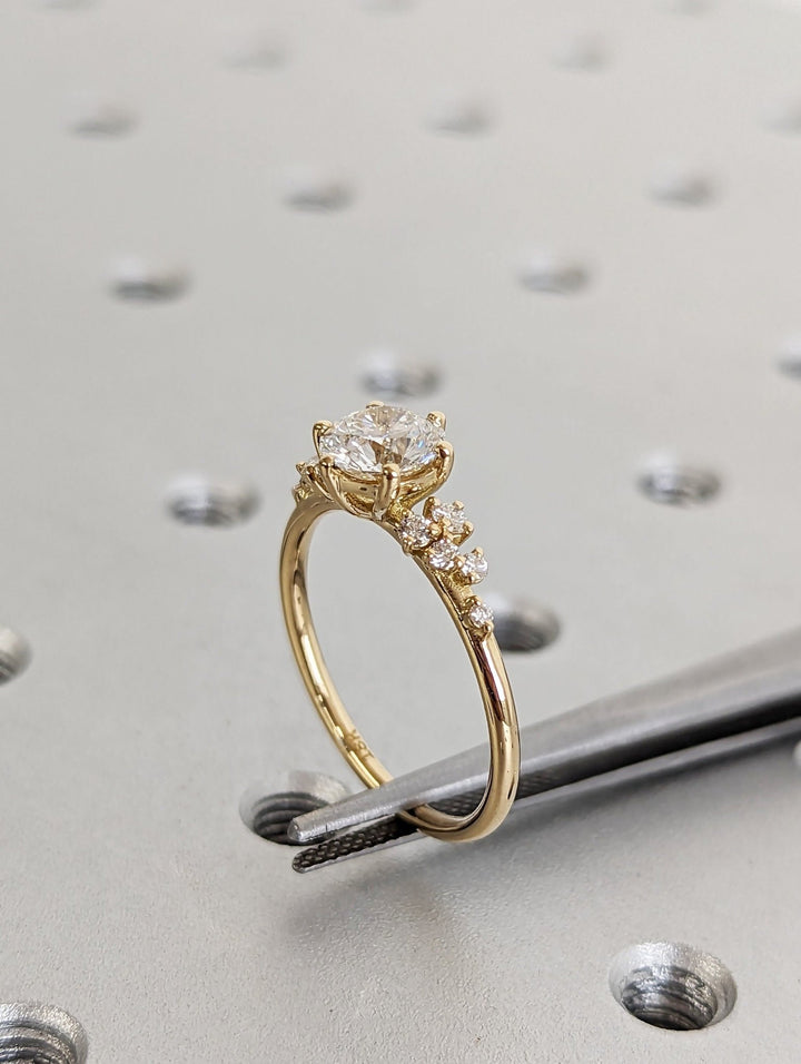 Shop the round cut cluster engagement ring collection online