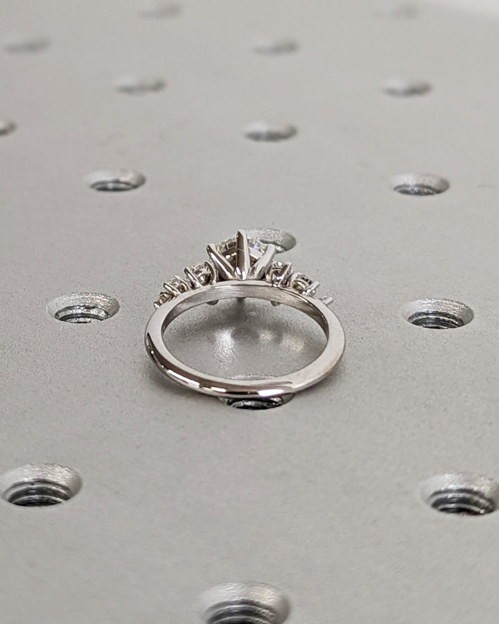 Shop the round cut cluster engagement ring collection online