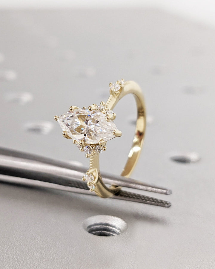 Marquise cluster engagement ring close-up showing high clarity diamond clarity