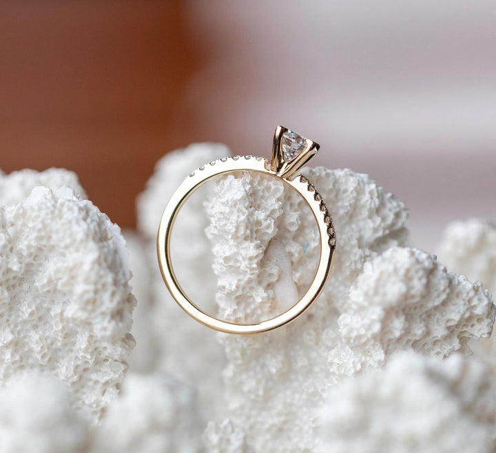Certified round cut diamond featured in solitaire engagement ring