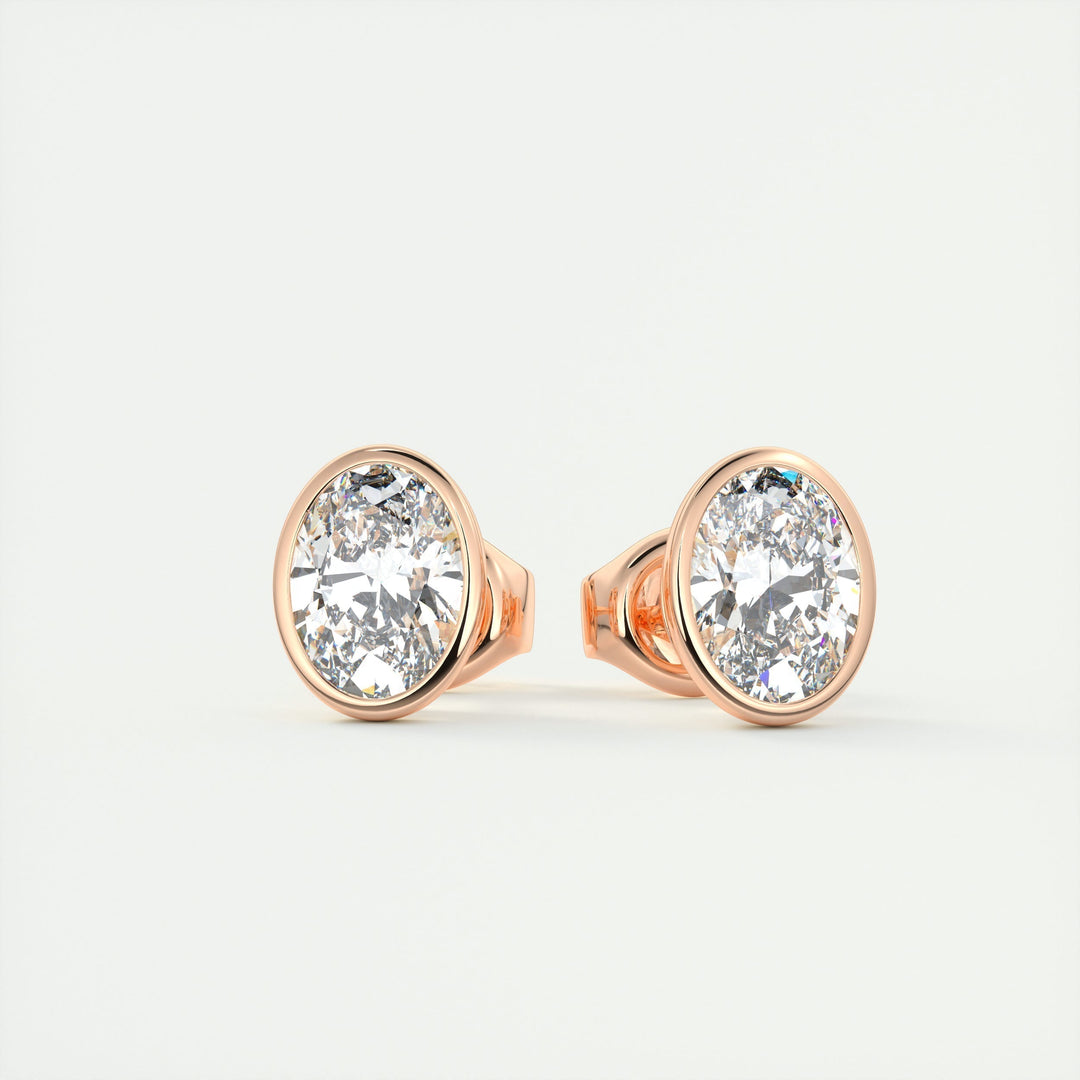 oval-bezel-solitaire-cvd-f-vs-diamond-earrings