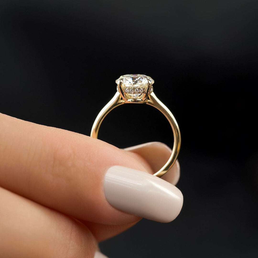 Round cut engagement ring shown with authenticity certificate