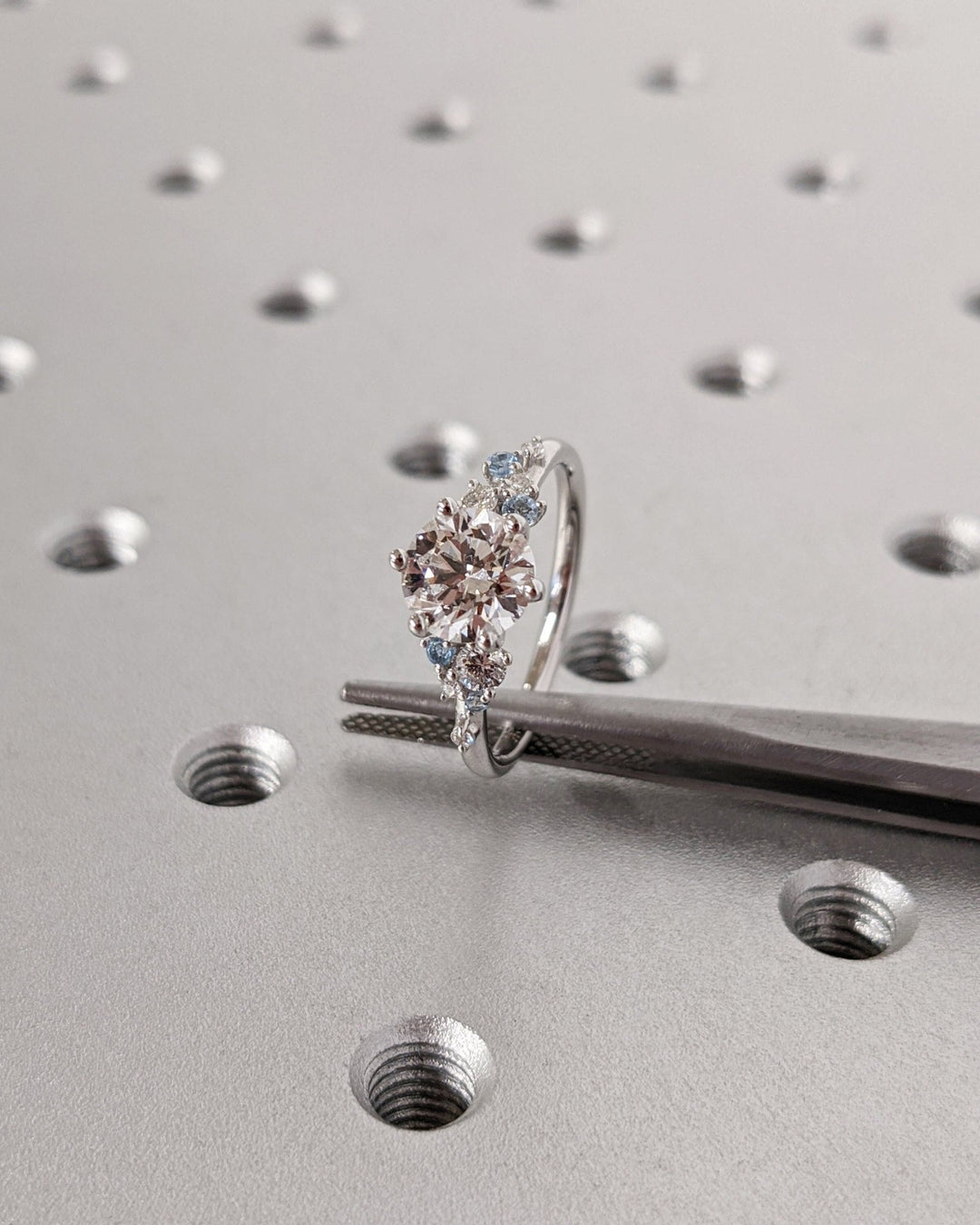 Macro shot of round cut diamond facets in cluster ring setting