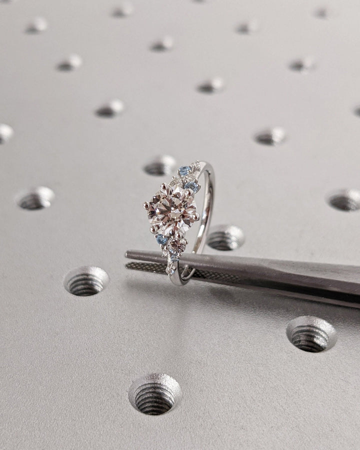 Macro shot of round cut diamond facets in cluster ring setting