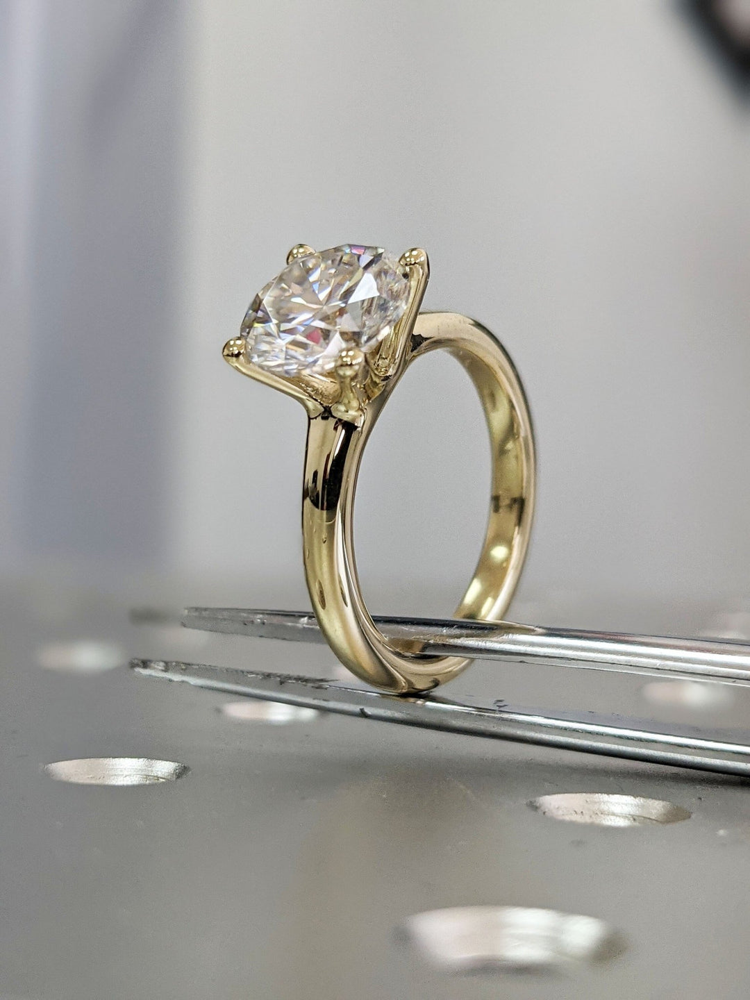 Round cut diamond ring worn on hand