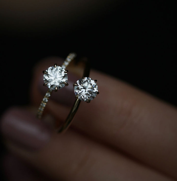 Side angle of round solitaire diamond engagement ring