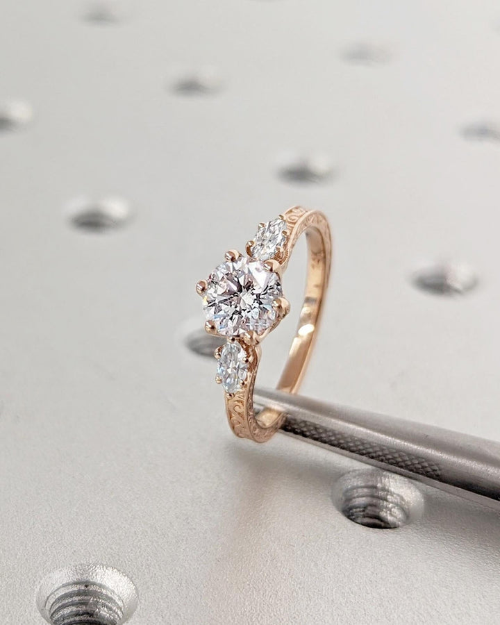 Shop the round cut three stone engagement ring collection online