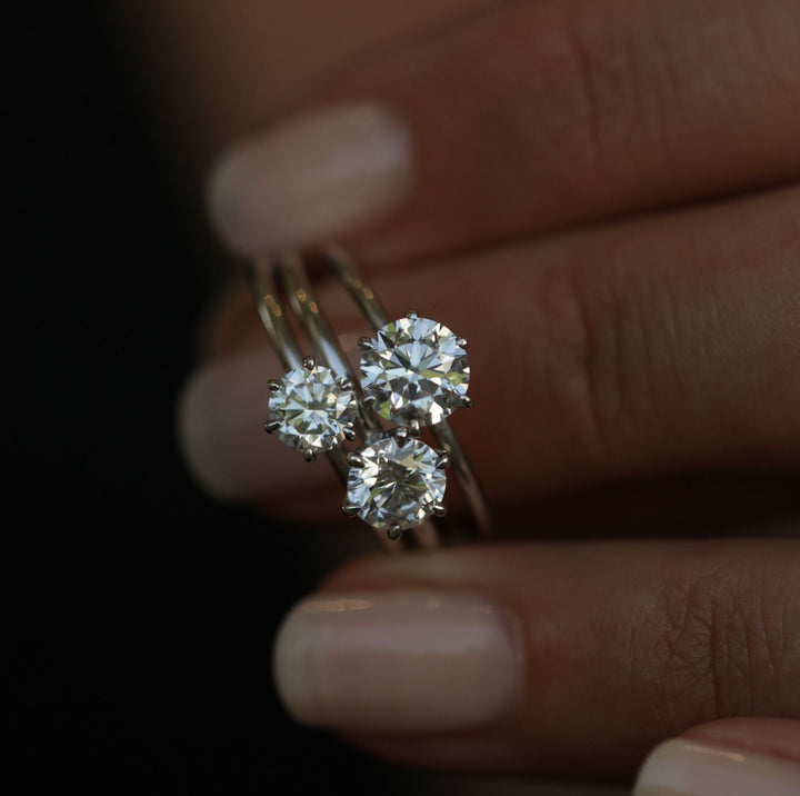 Round solitaire engagement ring finished in polished solid gold