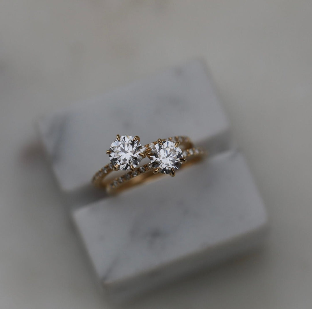 Round cut engagement ring side view showing band detail