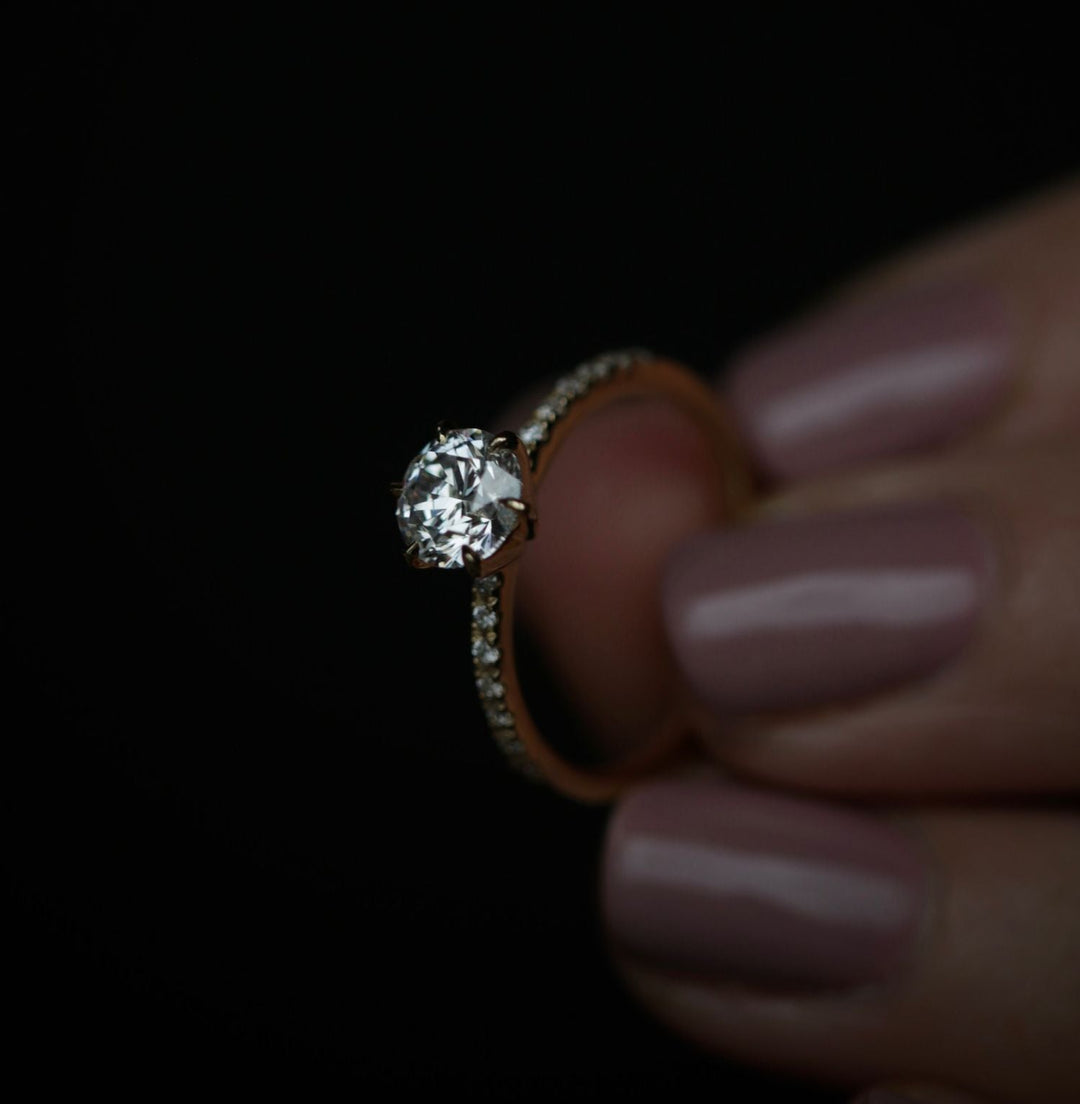 Round cut engagement ring side view showing band detail