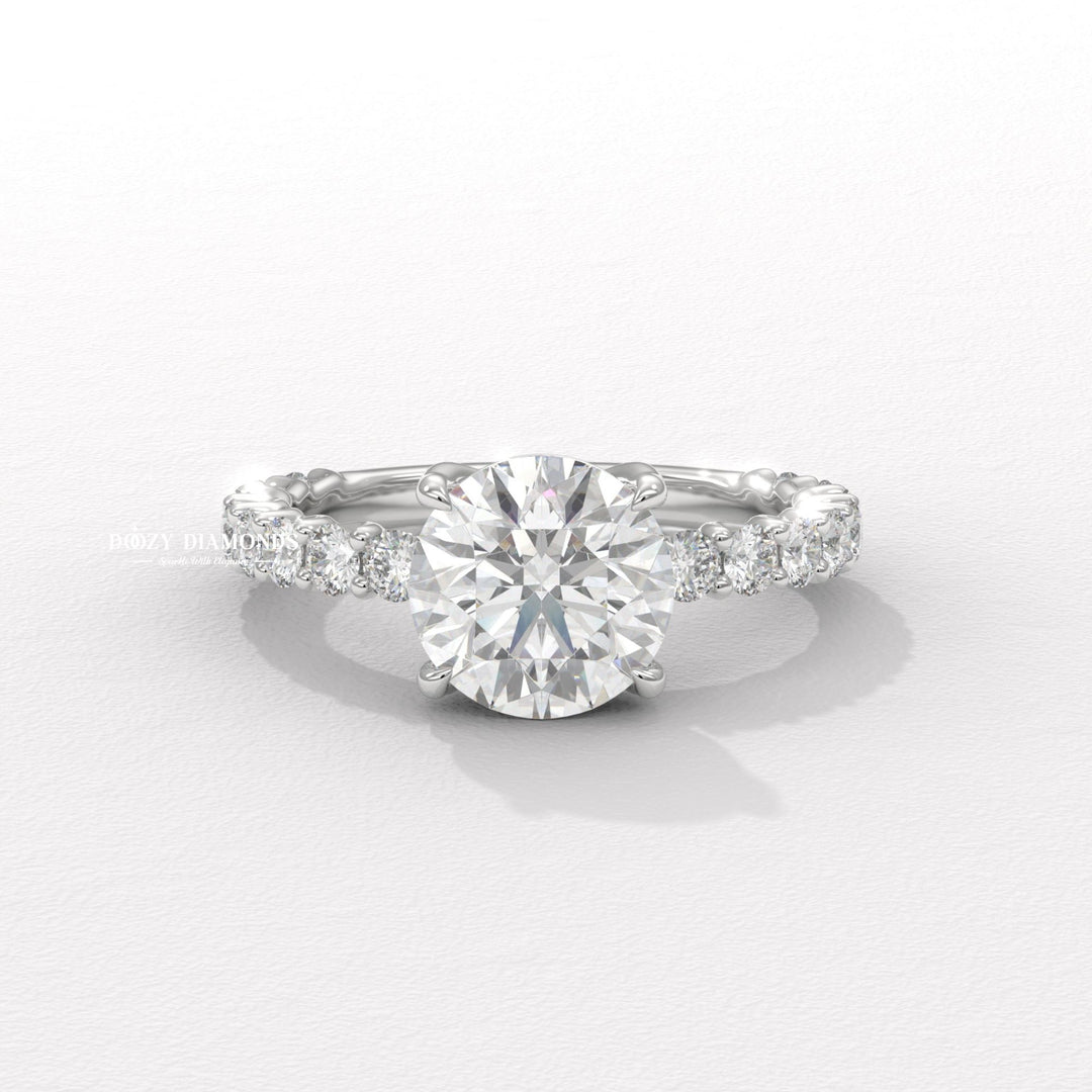 Round cut solitaire engagement ring shown in real-life wear