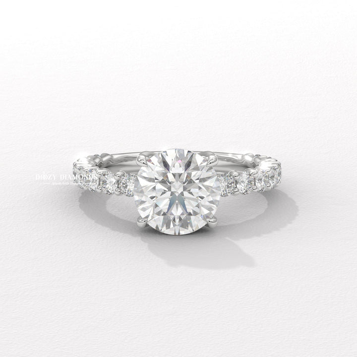 Round cut solitaire engagement ring shown in real-life wear